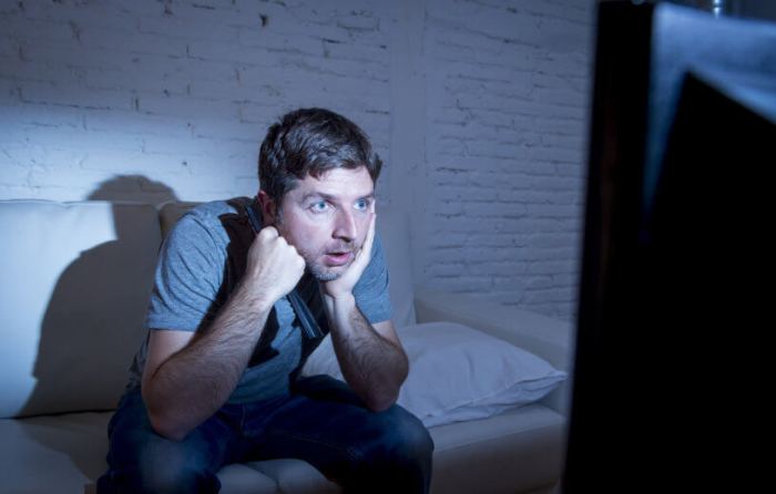 Tv sitting watching front television binge man people stock far porn less shows than rise racing couch wordley adobe calvo